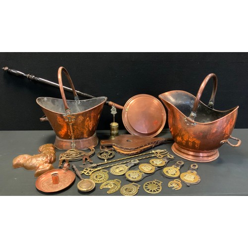 18 - A Victorian copper helmet shaped coal scuttle;  another;  warming pan, horse brasses etc
