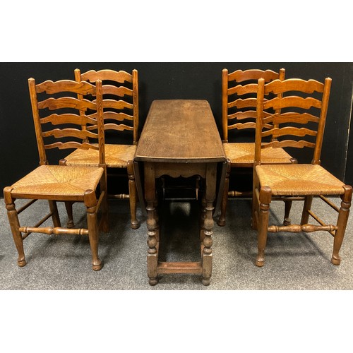 207 - A set of four 19th century elm ladder-back chairs, rush seats, turned legs and stretchers;  a confor... 