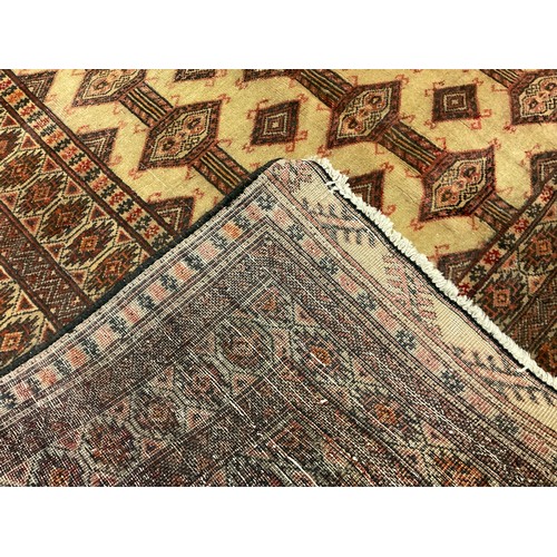 209 - A North East Persian silk and wool mix Turkoman Rug, 225cm x 124cm.