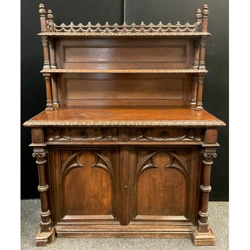 212 - A Victorian oak Gothic Revival Chiffonier, carved and pierced three-quarter galleried top with finia... 