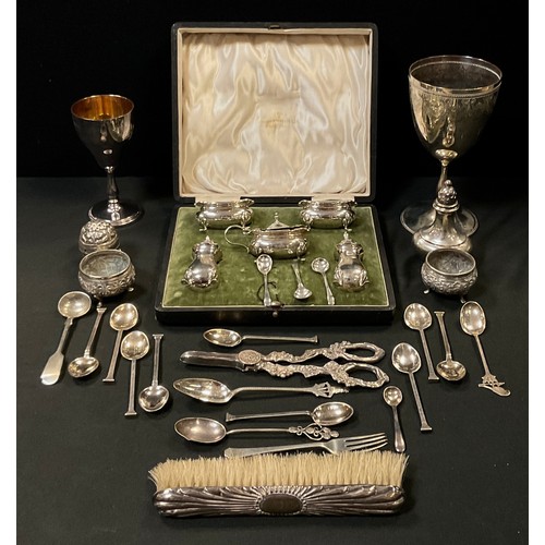 247 - A set of nine silver coloured metal tea spoons, elephant and sterling marks;  others unmarked;  thre... 