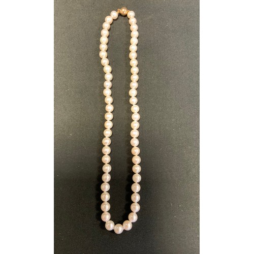 255 - A single strand cultured pearl necklace, 9ct gold ball clasp, 44cm long.