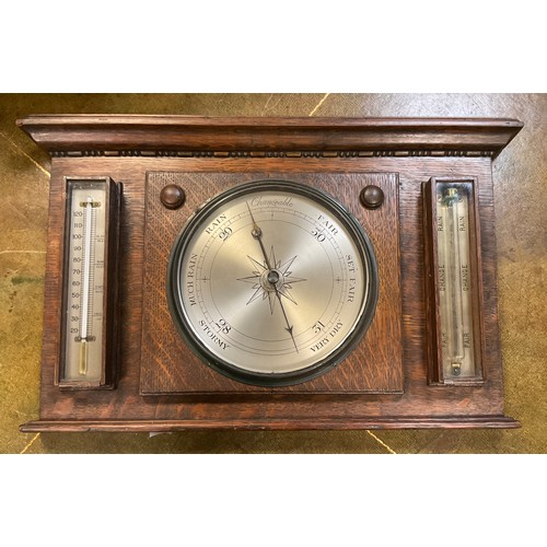 190A - An Edwardian oak ACMA wall mounting weather station, barometer, thermometer, storm glass, 33cm x 54c... 