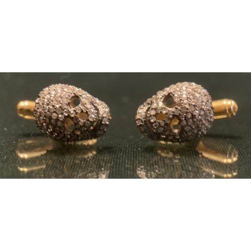 271 - A pair of diamond Skull cufflinks, each pave encrusted with rose cut diamonds, total estimated diamo... 