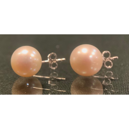 260 - A pair of diamond and cultured pearl earrings, round brilliant cut diamond approx 0.13ct above a fix... 