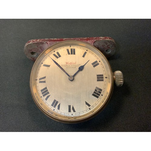 218A - Automobilia - a vintage motor car dashboard clock, the 6cm silvered dial inscribed Watford, North & ... 