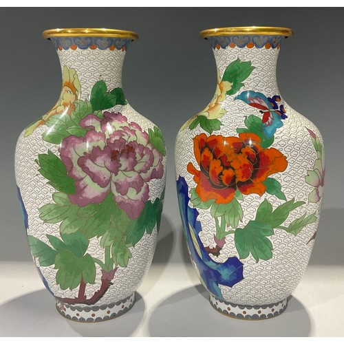 48 - A pair of Chinese cloisonne ovoid vases, decorated in polychrome with flowers and butterflies, 25cm ... 