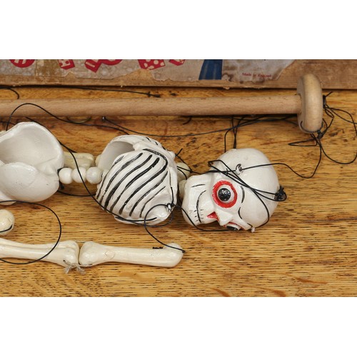 58 - A Pelham Puppets Disjointed Skeleton standard puppet, painted white and picked out in black, fixed b... 