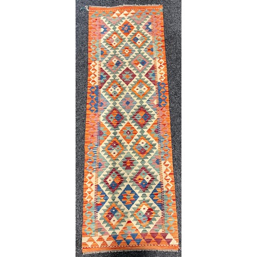 80 - Carpets - a Chobi Kilim runner or rug, multi-coloured geometric shapes and motifs, 198cm x 63cm