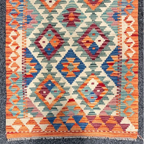 80 - Carpets - a Chobi Kilim runner or rug, multi-coloured geometric shapes and motifs, 198cm x 63cm