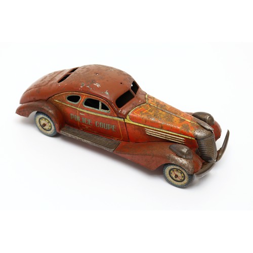 31 - Toys & Juvenalia - a Kuramochi (CK Toys, Japan) tinplate and clockwork Police coupe car, 28cm long, ... 