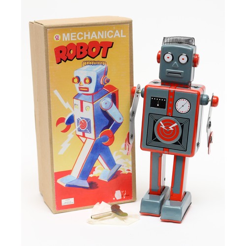 56 - Toys & Juvenalia - a Chinese tinplate and clockwork mechanical robot, 23cm high boxed with clockwork... 