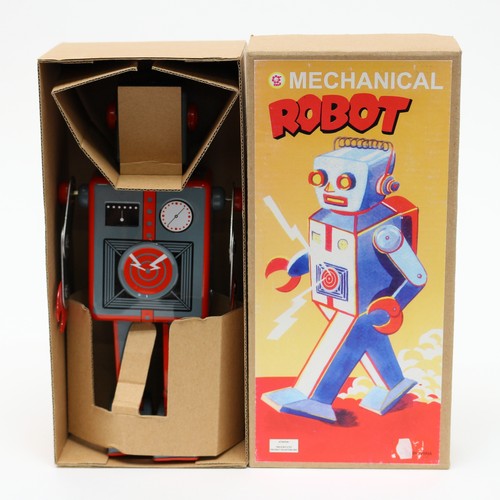 56 - Toys & Juvenalia - a Chinese tinplate and clockwork mechanical robot, 23cm high boxed with clockwork... 