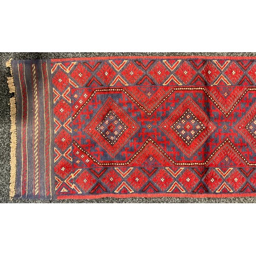 237 - Carpets - a Maimana Kilim woollen runner or rug, geometric shapes in tones of red and blue, 250cm x ... 