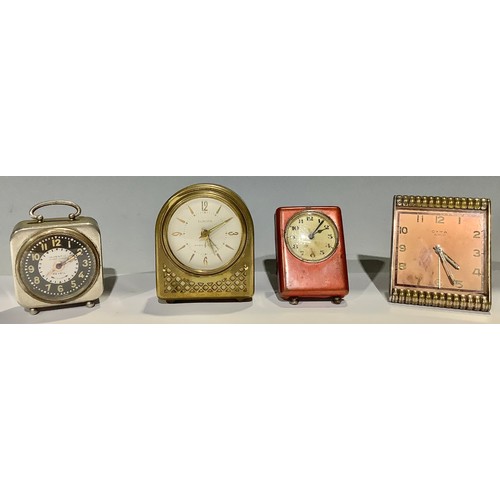 238 - A Cyma Art Deco clock; a Europa musical alarm; an Inventic alarm; another (4)