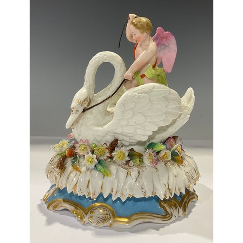 352 - A 19th century German porcelain box and cover, Cupid riding a swan, on an oval bed of flowers, turqu... 