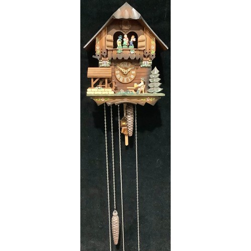 423 - A Black Forest musical cuckoo clock, by Schneider, three weights, pendulum, instructions