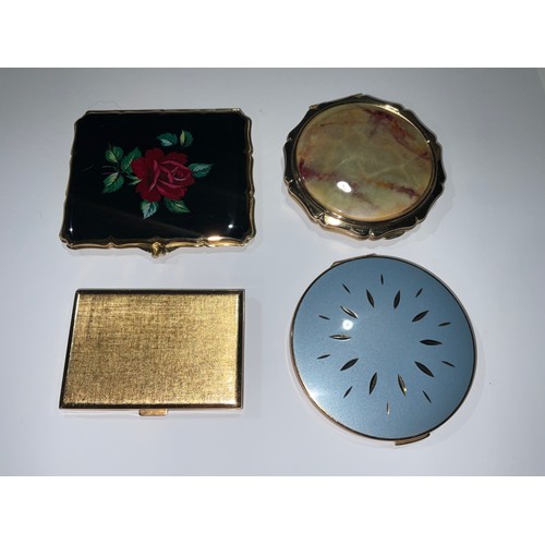 432 - A lady's 1960s Swiss rectangular powder compact, engine turned, with internal mirror, 7.5cm; two mid... 