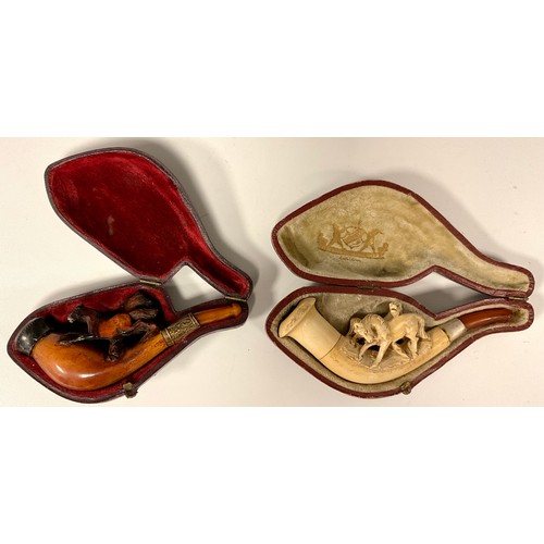 439 - A Victorian meerschaum pipe, the bowl with two crossing horses, 12cm long; another similar 10.7cm lo... 