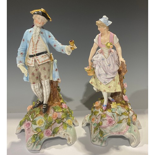 469 - A pair of Sitzendorf figures, gallant and maiden, floral encrusted domed scroll bases, 33cm, impress... 