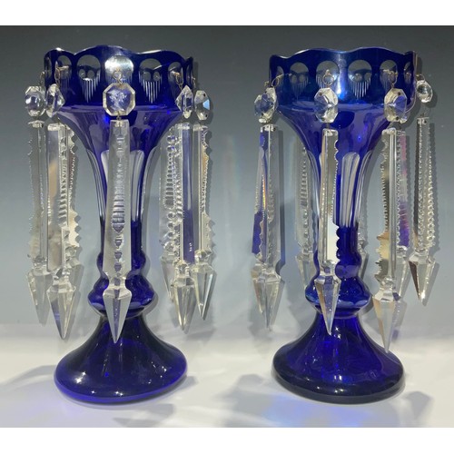 473 - A pair of late 19th century Bohemian blue flashed lustres, prismatic cut glass droplets, 30cm