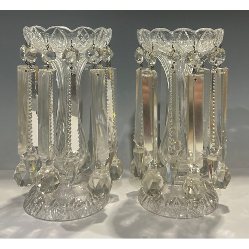 494 - A pair of clear glass lustres, alternating prismatic and hammer droplets, 28cm