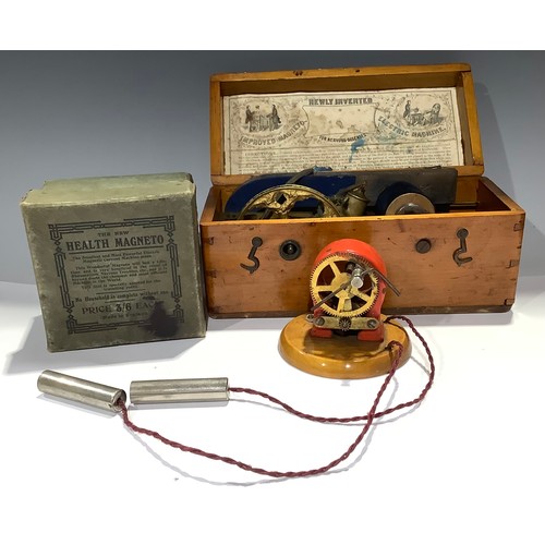 460 - A late 19th/early 20th century hand-cranked electrotherapy device, cased; another, The New Health Ma... 