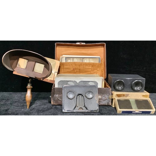 505 - An early 20th century stereoscopic viewer, 31cm long; a collection of Victorian and Edwardian stereo... 