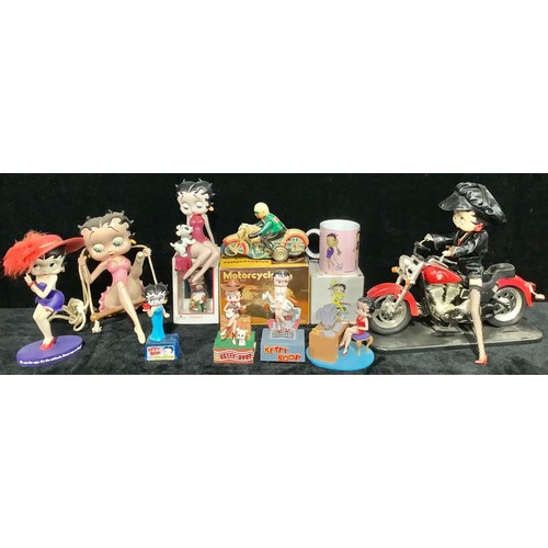 561 - A collection of Betty Boop models, various poses, including large model of Betty Boop on a motorbike... 