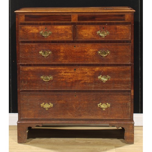 102 - A George III oak and mahogany chest, of two short and three long graduated drawers, bracket feet, 11... 