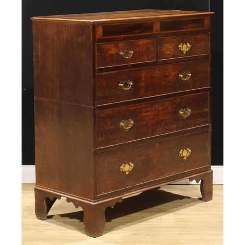 102 - A George III oak and mahogany chest, of two short and three long graduated drawers, bracket feet, 11... 