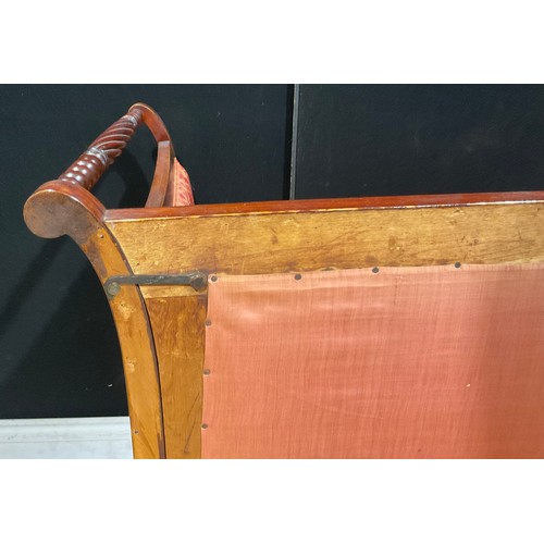 111 - A late 19th century campaign sofa, dismantling for transport, the back with fluted fan cresting, tur... 