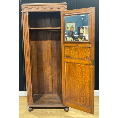 201 - An oak hall cupboard or hanging press cabinet, linenfold panel door, 193.5cm high, 80.5cm wide, 40cm... 