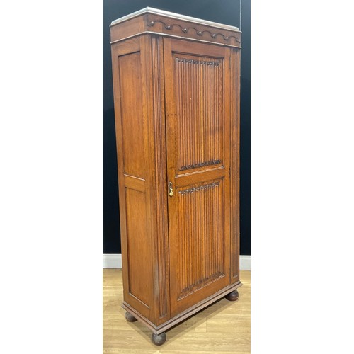 201 - An oak hall cupboard or hanging press cabinet, linenfold panel door, 193.5cm high, 80.5cm wide, 40cm... 