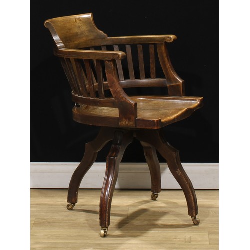 208 - An early 20th century oak swivel desk chair, 83cm high, 59cm wide, the seat 49.5cm wide and 46cm dee... 