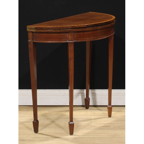 218 - A Sheraton Revival satinwood crossbanded mahogany demilune card table, 71.5cm high, 75cm wide, 37cm ... 