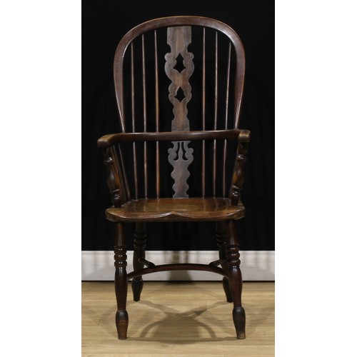 415 - A Yorkshire beech, ash and elm Windsor elbow chair, 107cm high, 53cm wide, the seat 39cm wide and 33... 