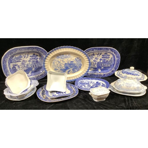 640 - Staffordshire Blue and White - willow pattern meat plates, the largest 46cm wide; a mid 19th century... 