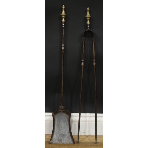 686 - A 19th century steel and brass fireside companion set, comprising shovel and tongs, the shovel 72cm ... 