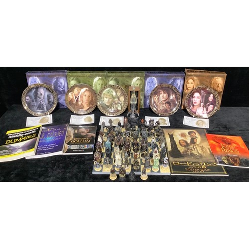 562 - A collection of Lord Of The Rings limited edition collectors plates; The Lord Of The Rings books; a ... 