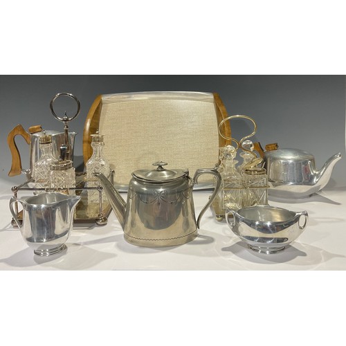 728 - A Piquot Ware four piece tea service on tray, mid-20th century; a silver plated cruet set; another; ... 