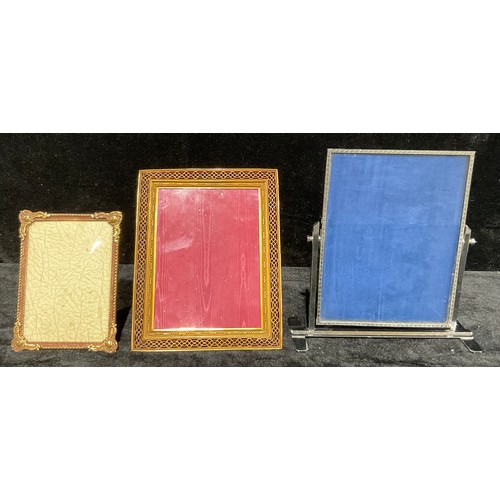 729 - A mid 20th century chrome easel photograph frame, 28cm x 27cm; a mid century Danish gilt metal photo... 