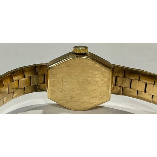 748 - A lady's 9ct gold Accurist watch, gilt dial with baton indicators, integral 9ct gold textured bark b... 