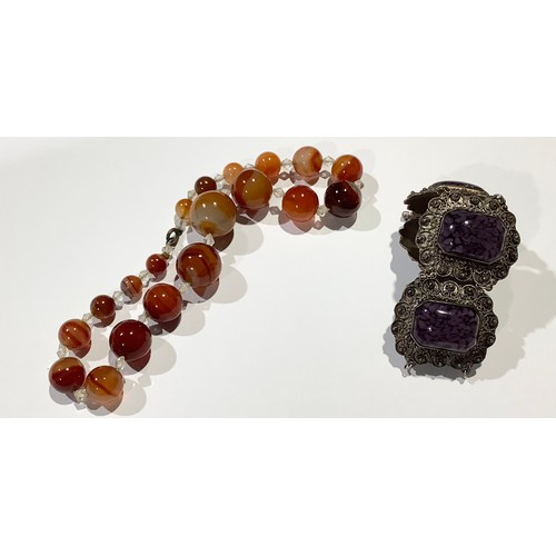 766 - Jewellery - a string of agate beads; a Continental silver bracelet, marked 950 (2)