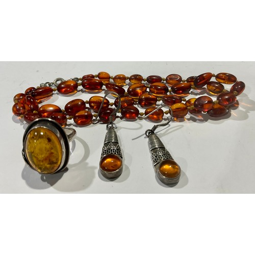 769 - Amber - Victorian amber beads; silver and amber earrings; a silver and amber ring