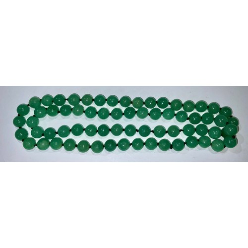 770 - A string of Chinese jade beads, 86cm long