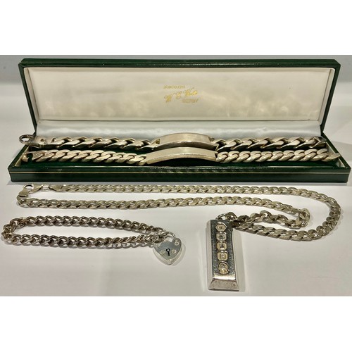 773 - A silver ingot pendant Sheffield 1977, silver necklace chain, 59g; two silver identity bracelets and... 