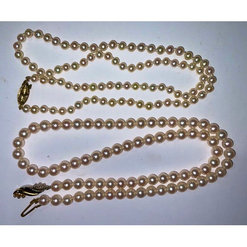 774 - A string of pearls, 9ct gold fastener; another (2)