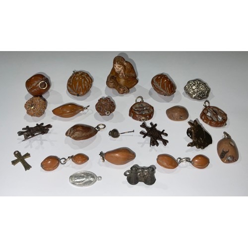 780 - An interesting collection of Oriental pierced and carved nut kernel pendants and other jewellery; et... 