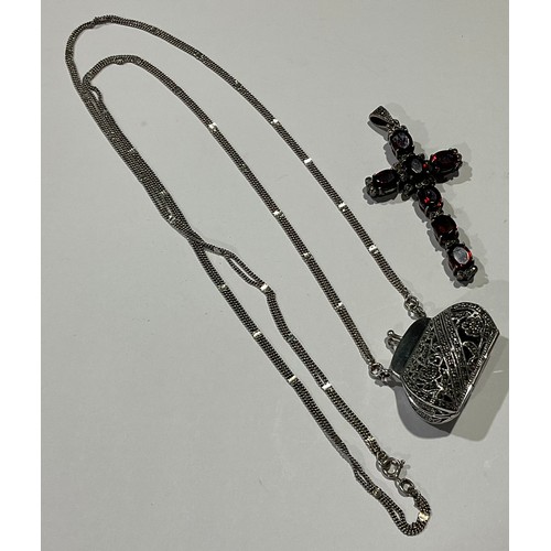 806 - A silver cross pendant set with seven oval cut garnets divided by marcasites; a silver coin pouch (2... 